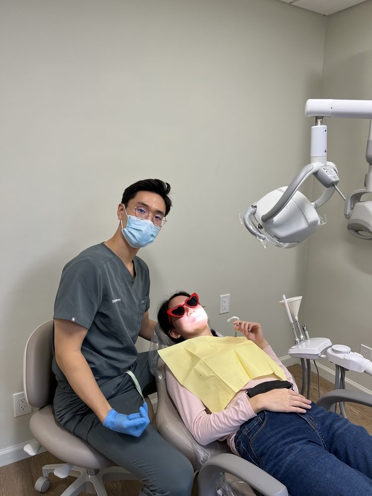 Dr. Shin with a patient in the treatment chair