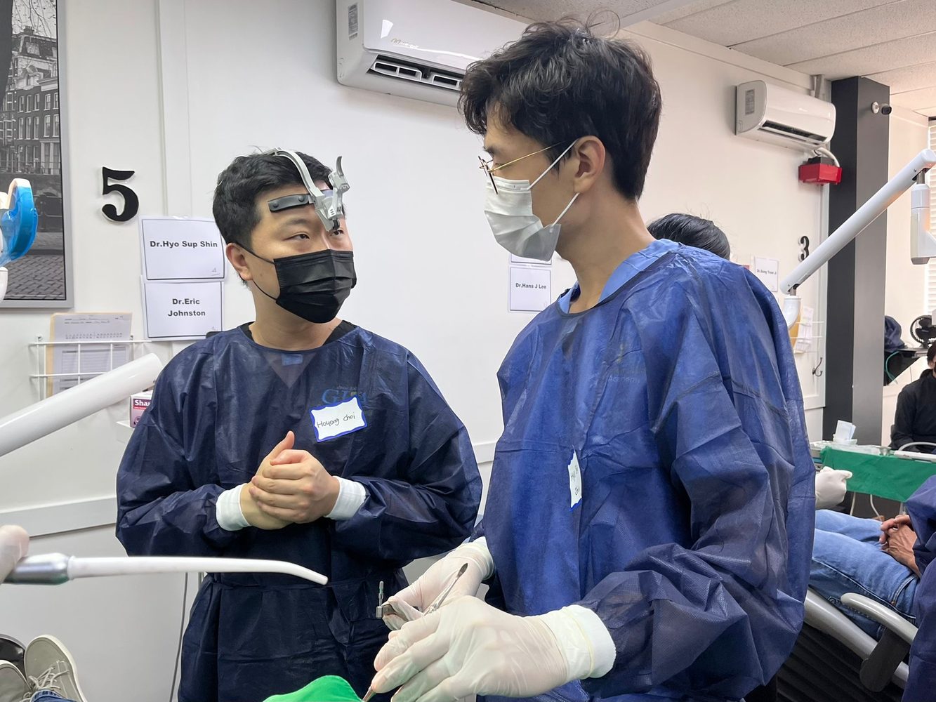Dr. Shin discussing a case during implant training